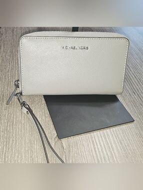 Authentic Michael Kors Zip Up Smartphone wristlet wallet in Stone Gray/silver